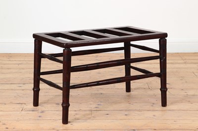 Lot 27 - A Victorian Aesthetic period walnut luggage rack