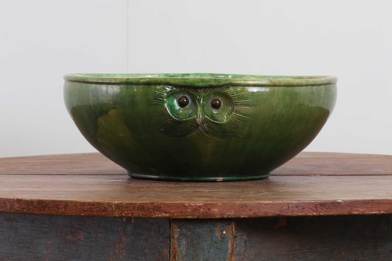 Lot 248 - A large green-glazed stoneware owl-form bowl