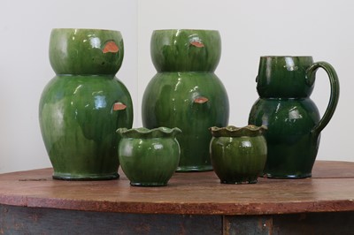 Lot 247 - A pair of large green-glazed stoneware owl-form ewers