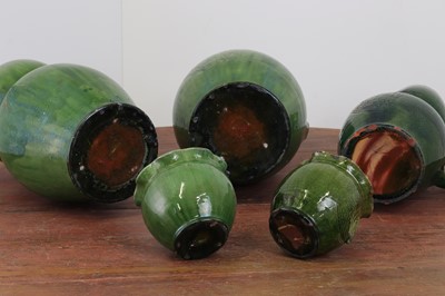 Lot 247 - A pair of large green-glazed stoneware owl-form ewers