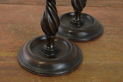Lot 520 - A pair of George III mahogany candlesticks in the manner of Gillow