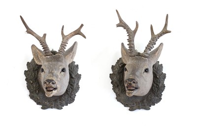 Lot 468 - A pair of terracotta trophy heads