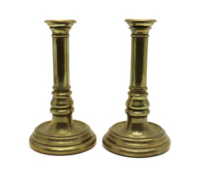 Lot 150 - A pair of sectional brass candlesticks