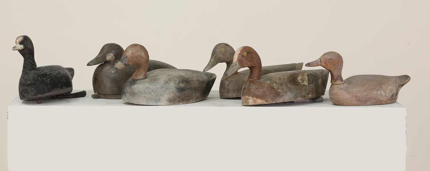 Lot 455 - A group of six carved wooden and painted decoy ducks