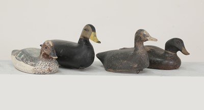 Lot 527 - A group of four carved wooden and painted decoy ducks