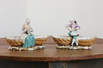 Lot 561 - A pair of Meissen porcelain figural double salts