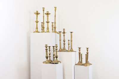 Lot 497 - A large collection of brass candlesticks