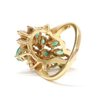 Lot 174 - A gold emerald and diamond cluster ring