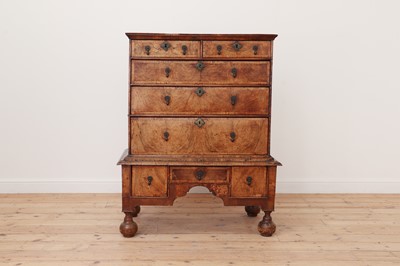 Lot 186 - A walnut chest on stand