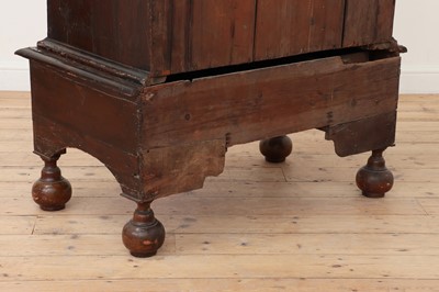 Lot 186 - A walnut chest on stand