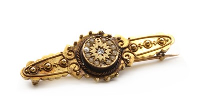 Lot 20 - A Victorian Etruscan revival 15ct gold diamond and split pearl brooch