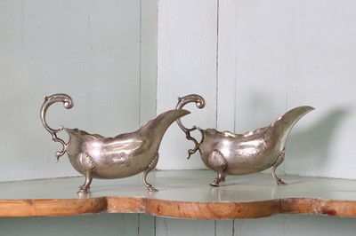 Lot 35 - A pair of George III silver sauce boats