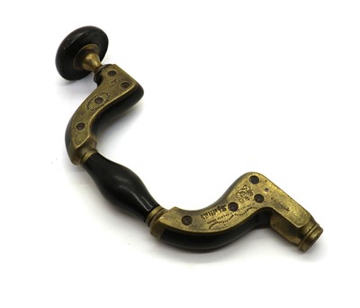 Lot 191 - A brass mounted ebony Carpenter's brace