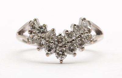 Lot 122 - An 18ct white gold shaped two row diamond ring