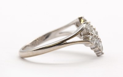 Lot 122 - An 18ct white gold shaped two row diamond ring