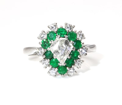 Lot 467 - A diamond and emerald pear shaped cluster ring