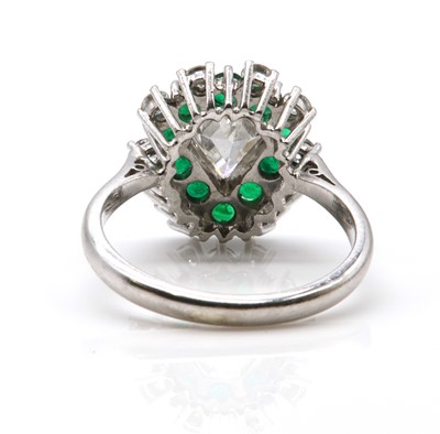 Lot 467 - A diamond and emerald pear shaped cluster ring