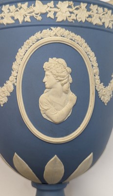 Lot 79 - A pair of Wedgewood Jasperware twin-handled vases and covers