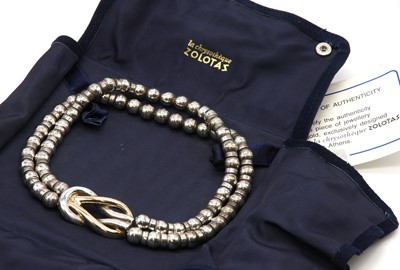 Lot 236 - A Greek silver and gold two row bead necklace, by Zolotas