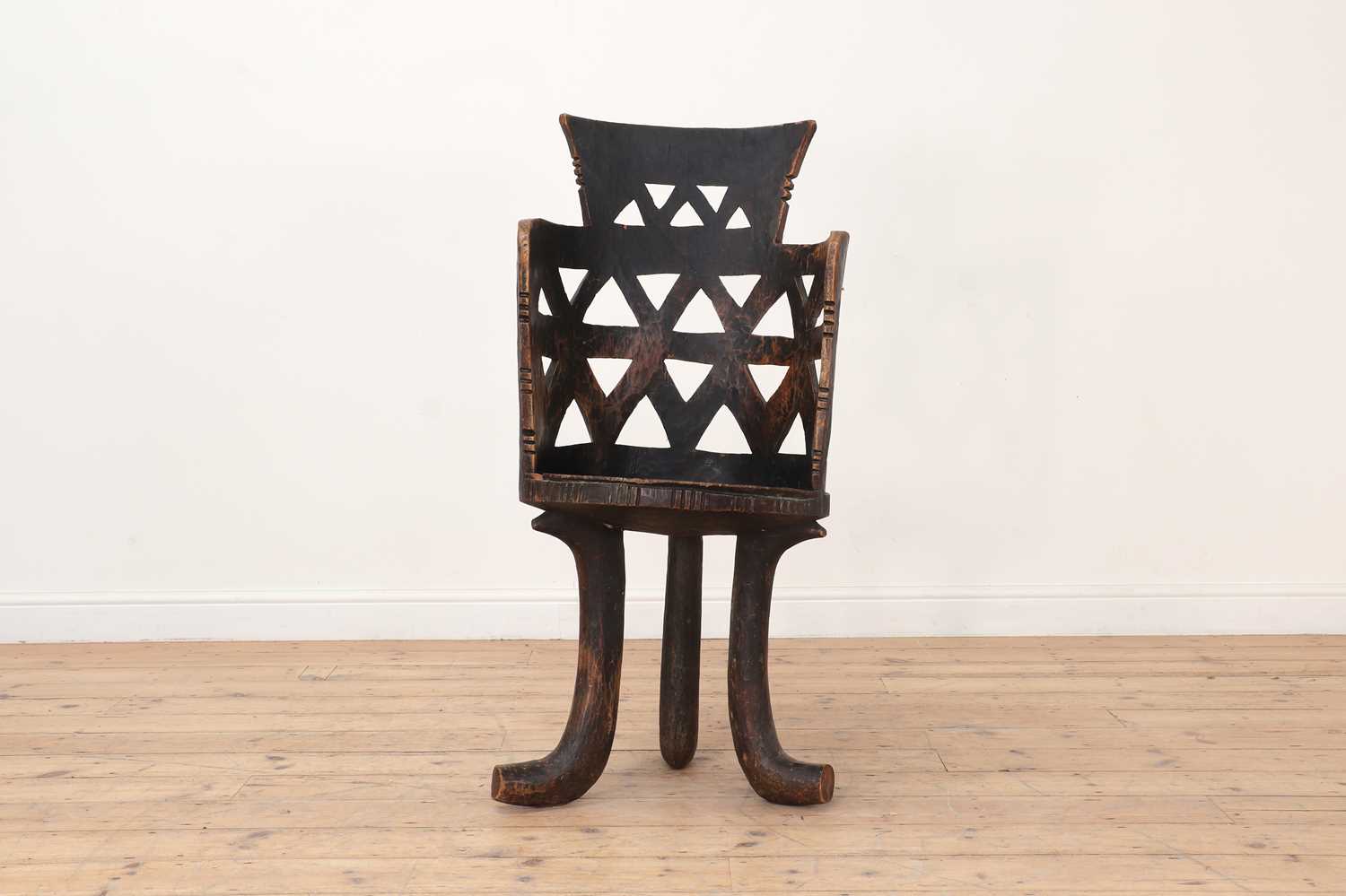 Lot 57 - A carved wooden chair