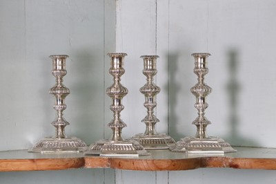 Lot 321 - A pair of cast silver candlesticks in the 18th century-style