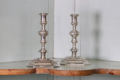 Lot 317 - A pair of Queen Anne cast Britannia standard silver candlesticks