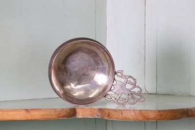 Lot 334 - A Queen Anne Britannia standard silver bleeding bowl or quaich
