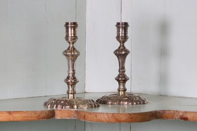 Lot 318 - A pair of George II cast silver candlesticks