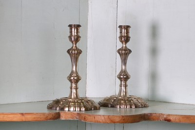 Lot 319 - A pair of George II cast silver candlesticks