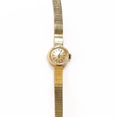 Lot 401 - A ladies' gold Tissot mechanical bracelet watch