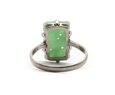 Lot 171 - A white gold carved jade ring
