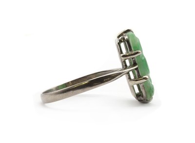 Lot 171 - A white gold carved jade ring