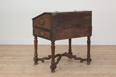 Lot 122 - A hardwood, ebony and brass desk on stand