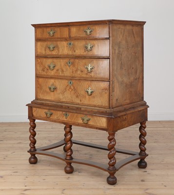 Lot 264 - A William and Mary walnut and feather band chest on stand
