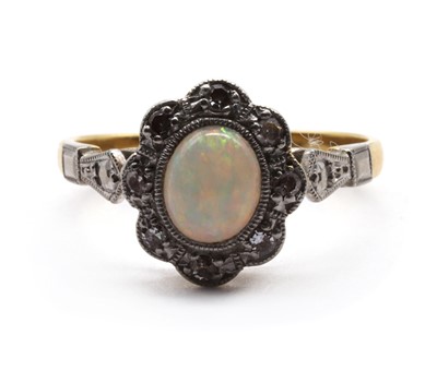 Lot 65 - A gold opal and diamond cluster ring