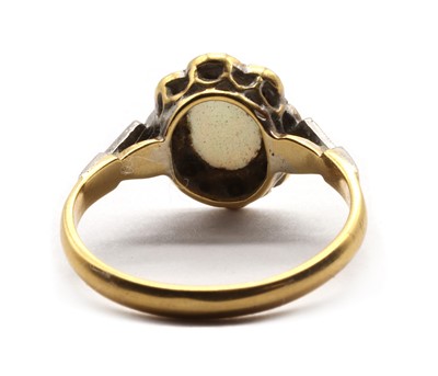 Lot 65 - A gold opal and diamond cluster ring