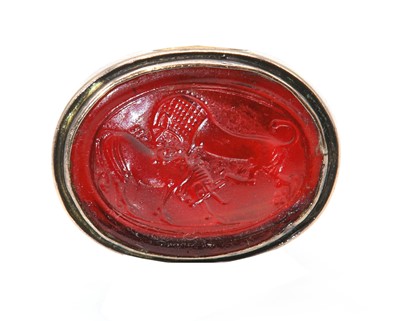 Lot 83 - A glass intaglio ring depicting 'Lion Attacking a Bull'