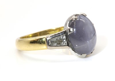 Lot 434 - An 18ct yellow and white gold single stone star sapphire ring
