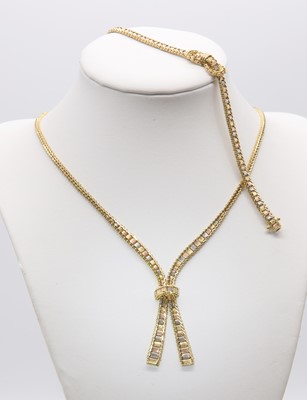 Lot 338 - A three colour gold necklace and bracelet suite, c.1980