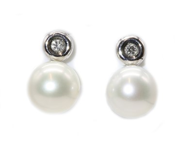 Lot 261 - A pair of cultured South Sea pearl and diamond stud earrings