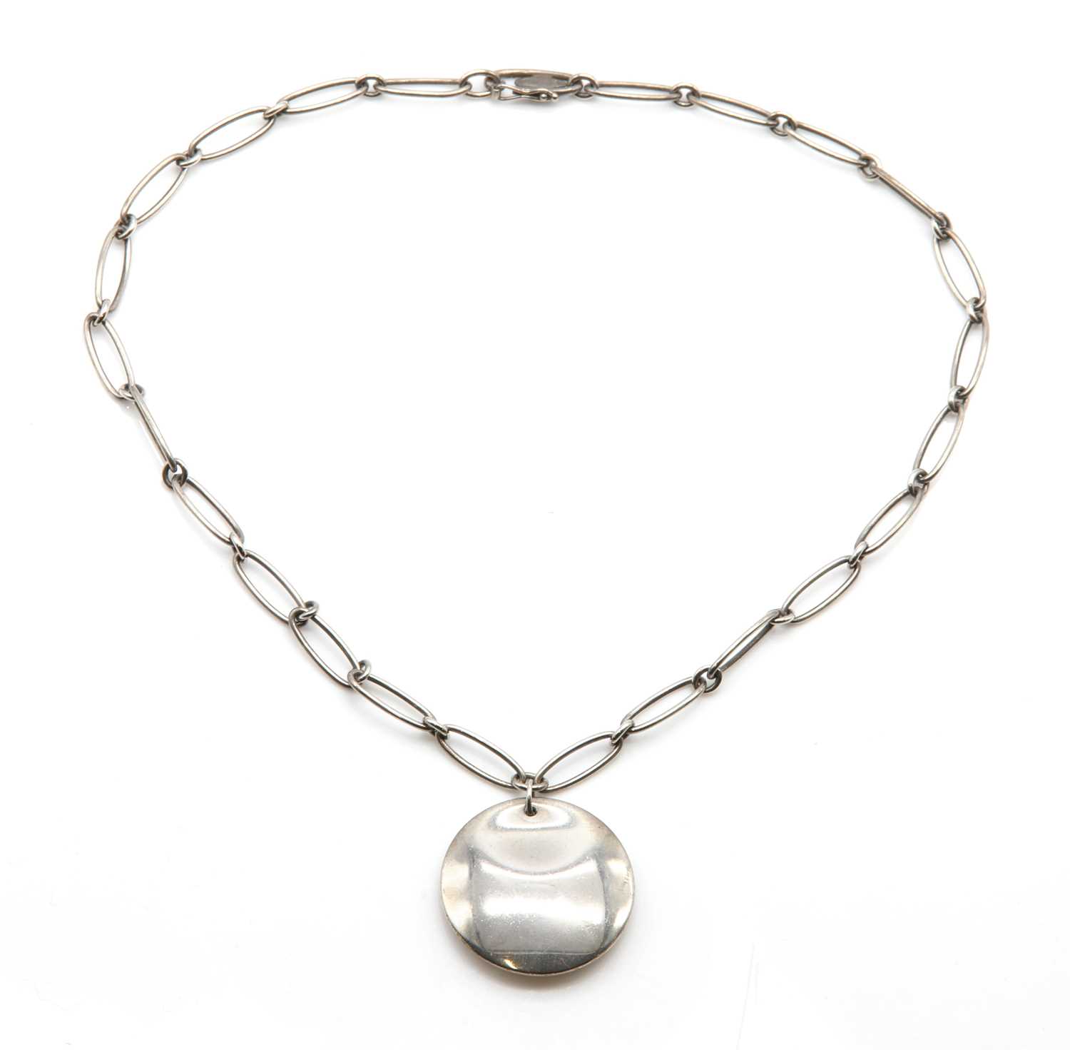 Lot 237 - A sterling silver disc pendant, by Elsa Peretti for Tiffany & Co.