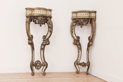 Lot 544 - A pair of painted and parcel-gilt corner tables