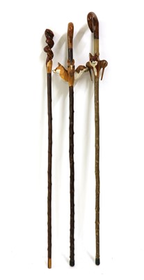 Lot 217 - Three modern carved walking sticks