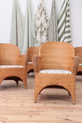 Lot 147 - A set of four rattan armchairs