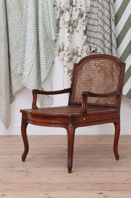 Lot 150 - A Louis XV-style walnut bergère fauteuil