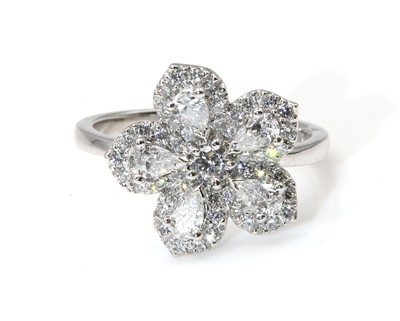 Lot 365 - An 18ct white gold diamond set flower head ring