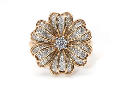 Lot 488 - A two colour rose and white gold diamond set flower head ring