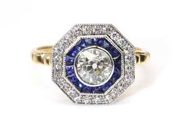 Lot 430 - An 18ct white and yellow gold diamond and sapphire octagonal diamond cluster ring