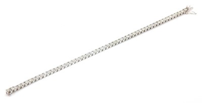 Lot 419 - An 18ct white gold diamond set line bracelet