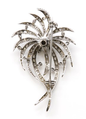 Lot 218 - A sapphire and diamond spray brooch, c.1950